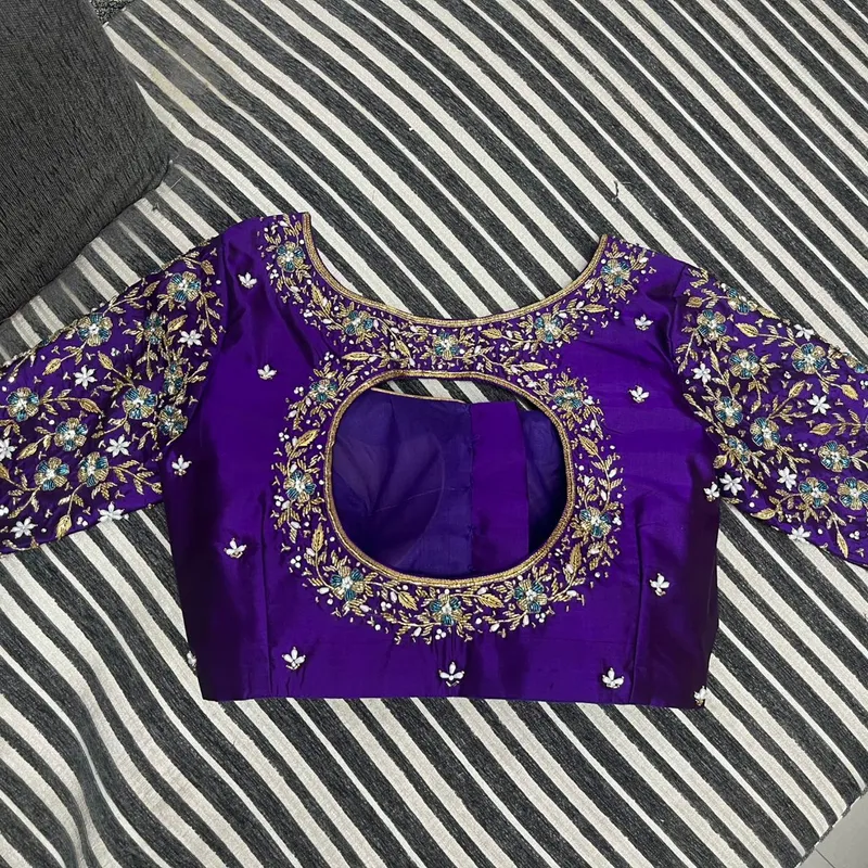 Purple blouse with circular cut-out back and heavy floral embroidery