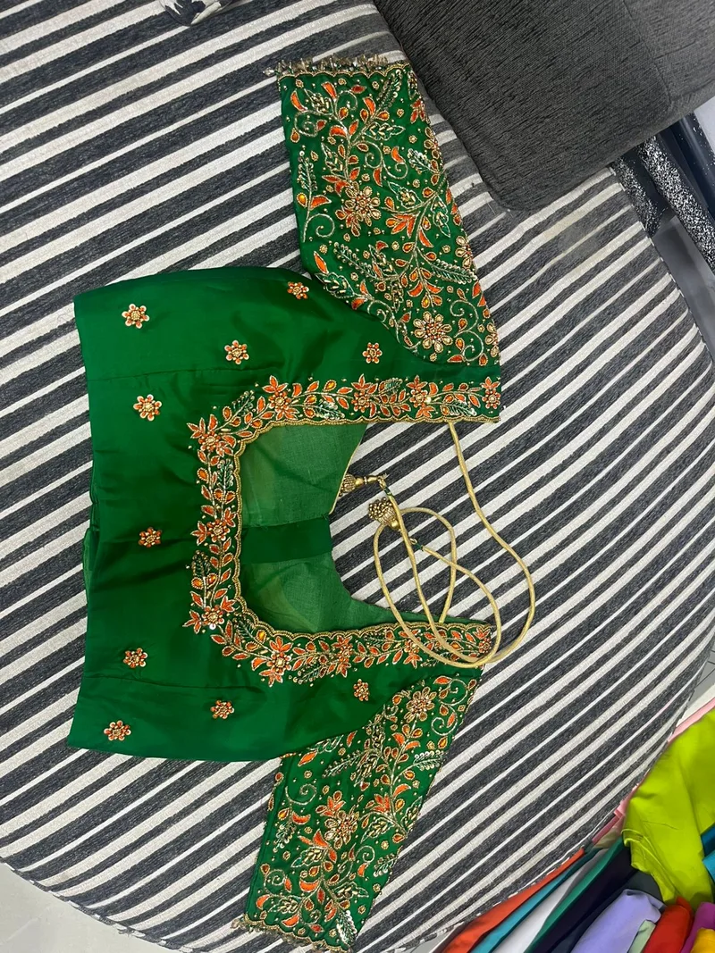 Green blouse with heavy gold embroidery — back neckline detail
