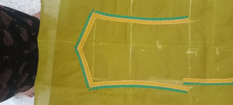 Olive green fabric with turquoise and yellow border embroidery work